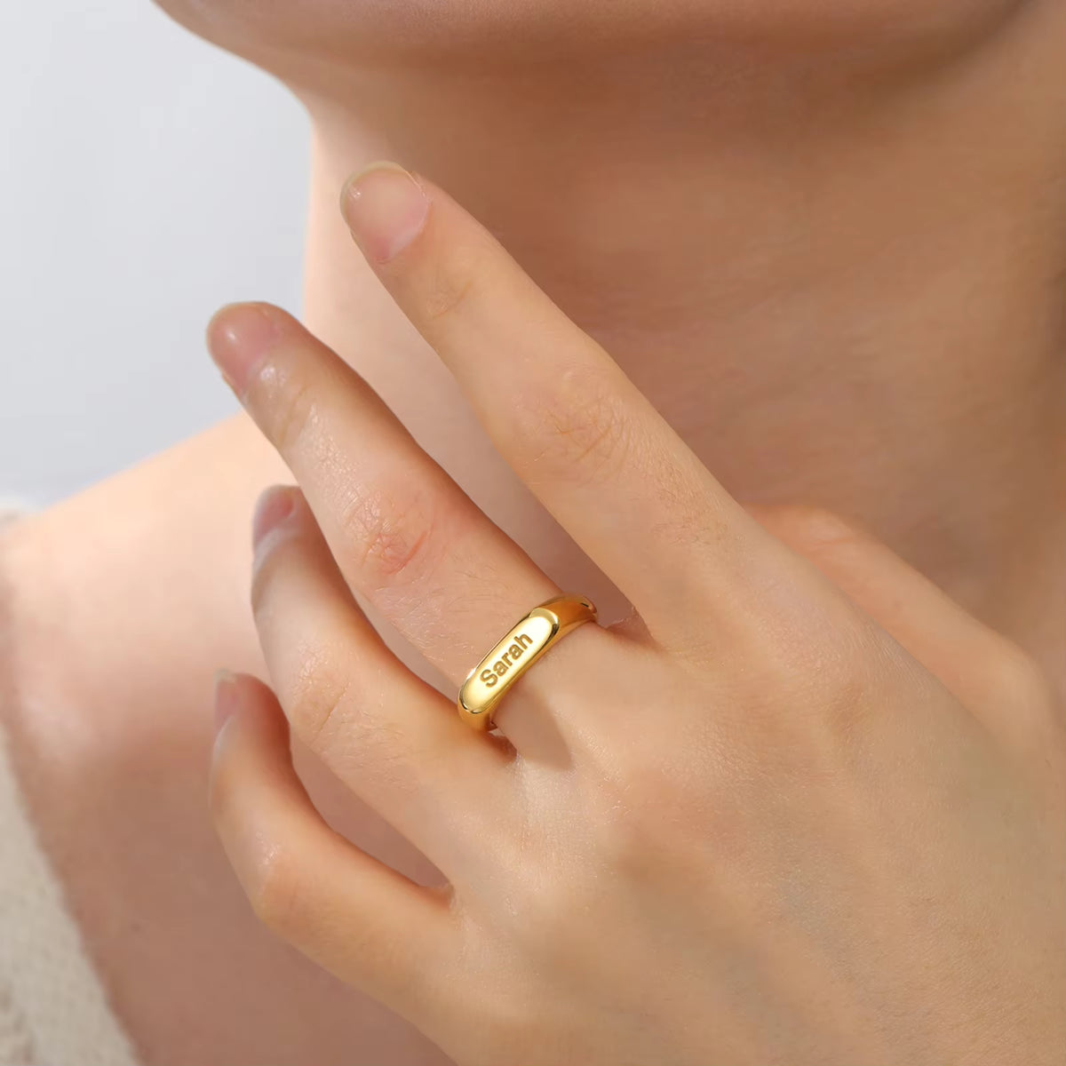 Woman wearing a personalised engraved ring