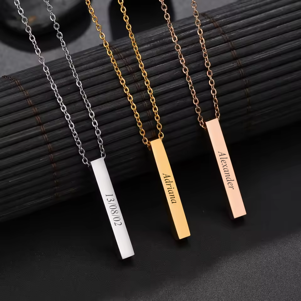 Personalised square bar pendants in silver, gold and rose gold, each engraved on its sides