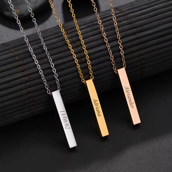 Personalised square bar pendants in silver, gold and rose gold, each engraved on its sides