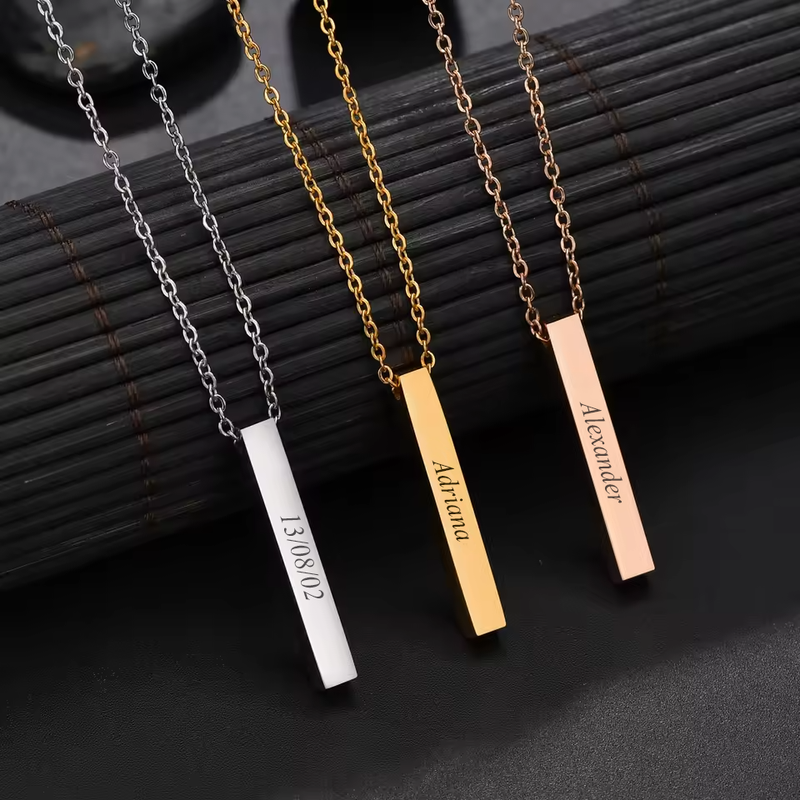 Personalised square bar pendants in silver, gold and rose gold, each engraved on its sides
